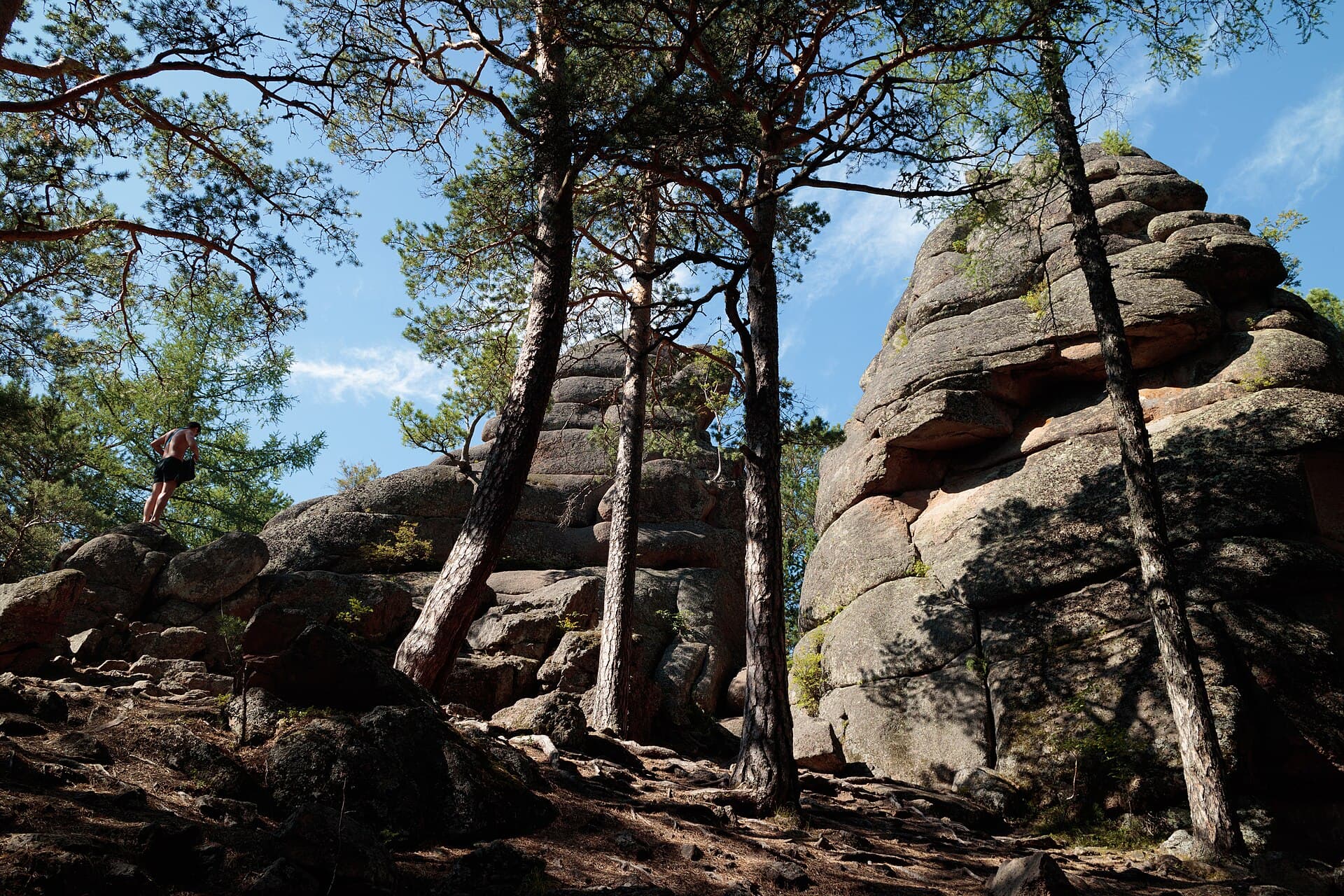 A walker among the boulders at Krasnoyarsk Pillars